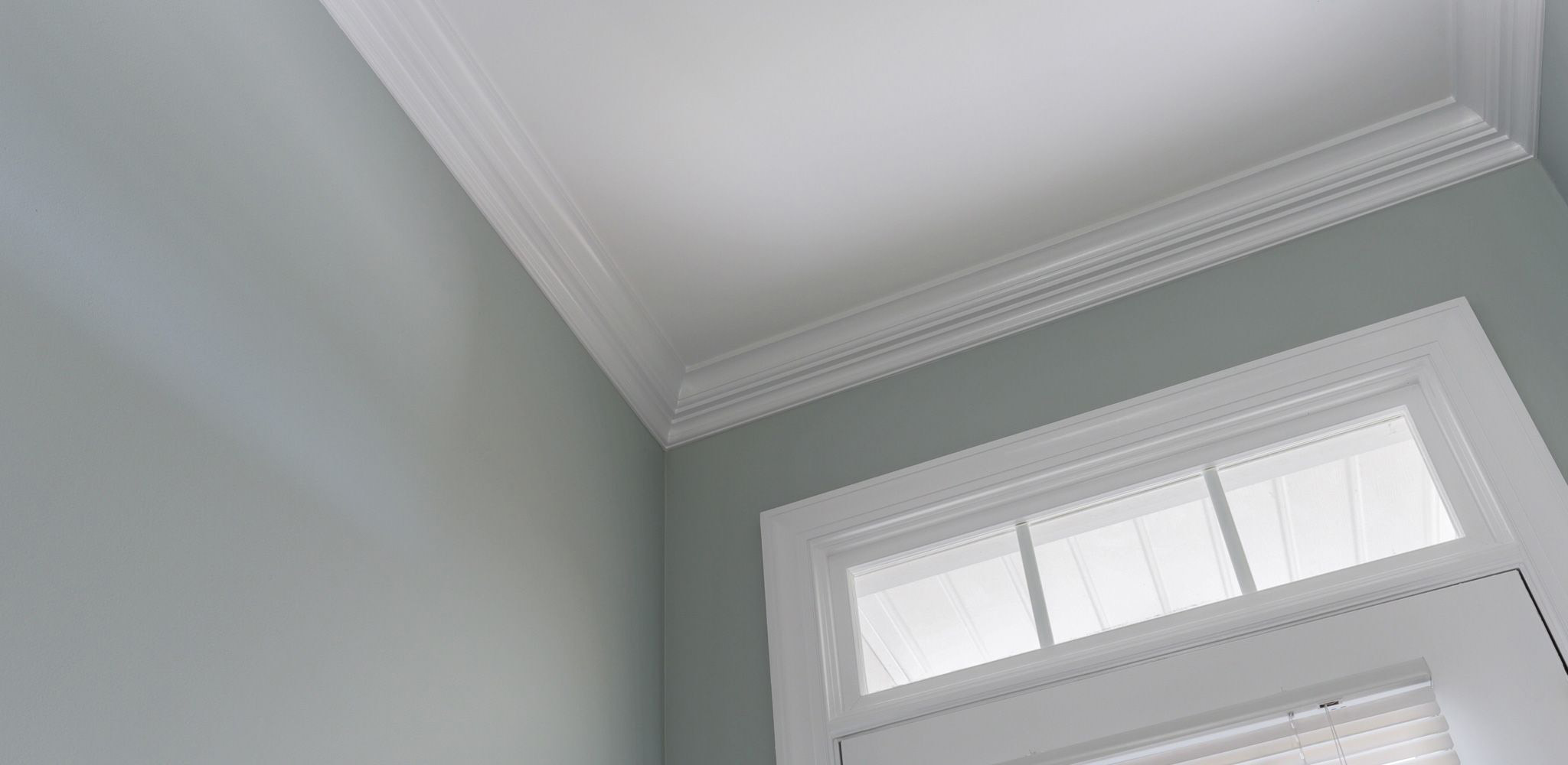  Notice the attention to detail and sharp painting of the crown molding, front door and door casing.